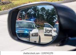 Cops In The Rear View Mirror